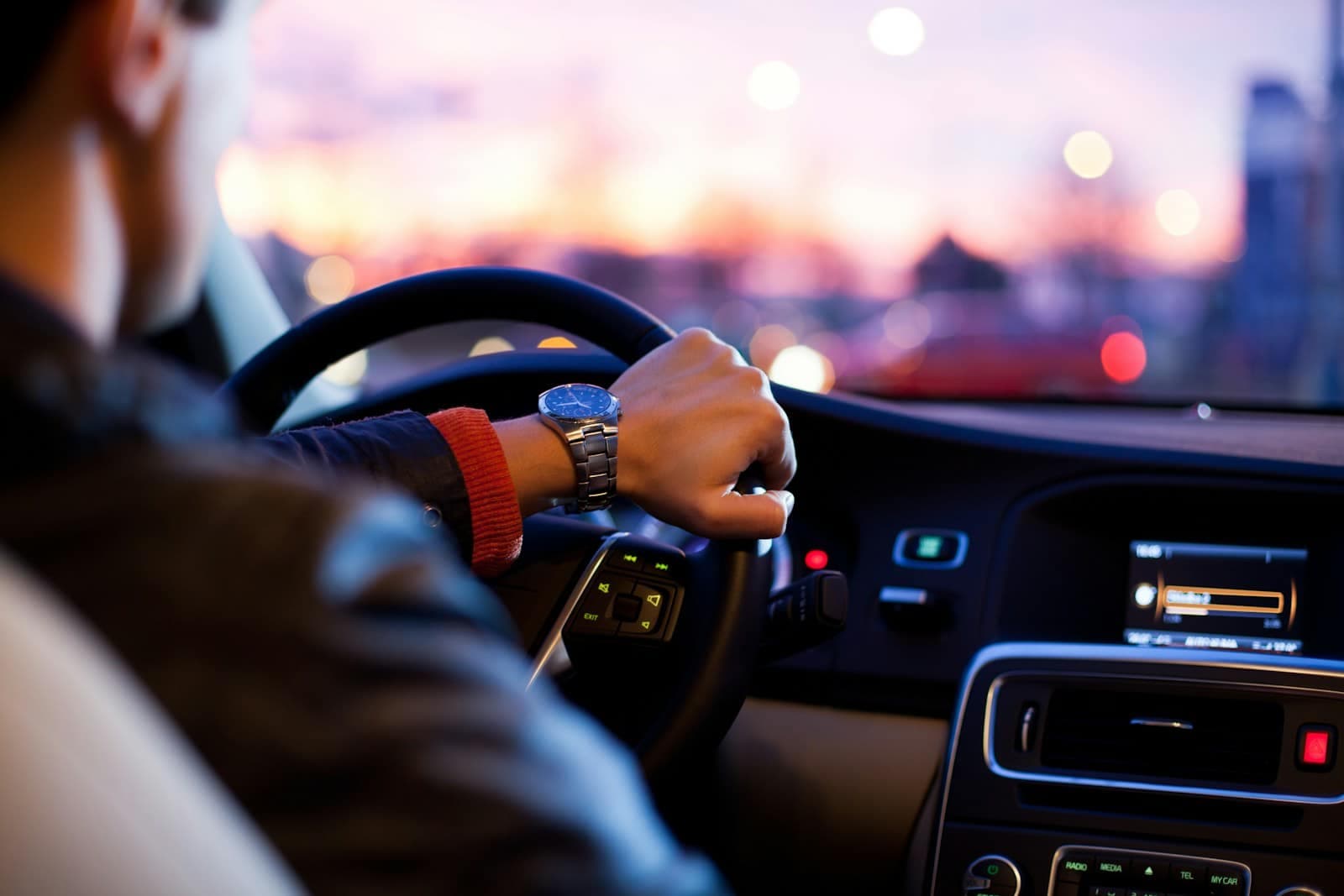 Clean leather interior of a premium vehicle with warm ambient lighting